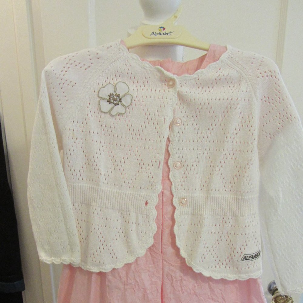 Girl's pink dress with white sweater